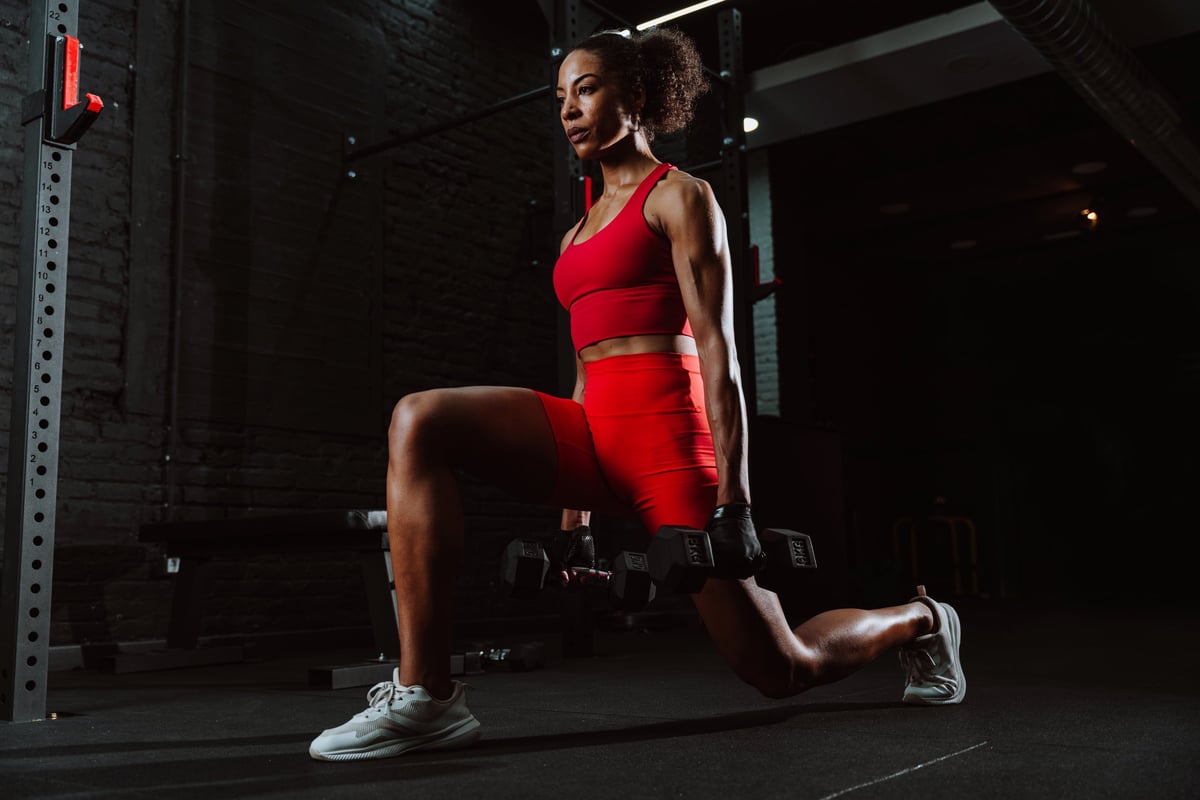 Young athlete strength training in gym